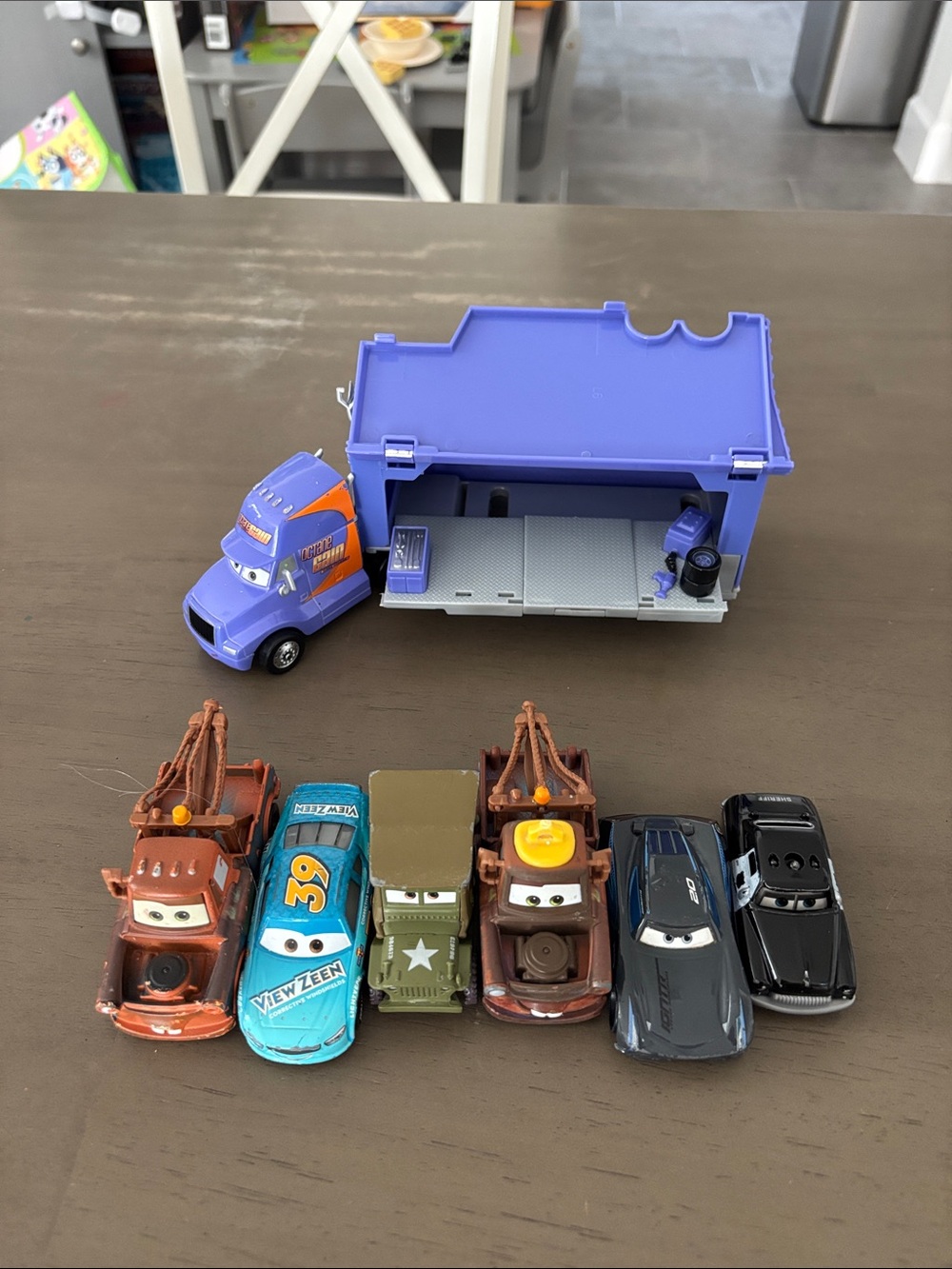 Disney Pixar Cars Purple Hauler Playset with Assorted Character Cars